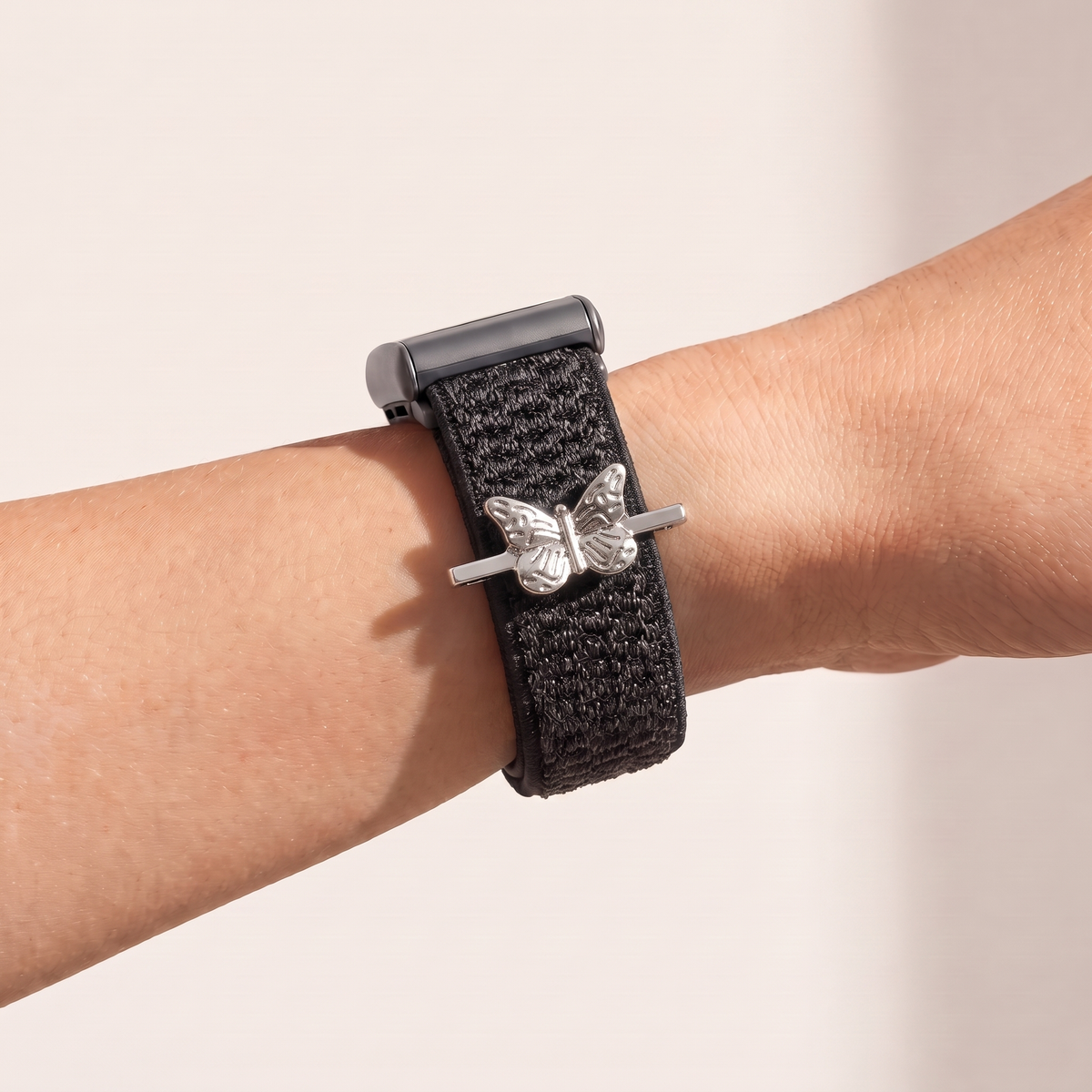 Charm Bar · Butterfly worn on a knit band